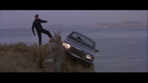 Roger Moore is James Bond in For Your Eyes Only kicking Locque's car off cliff
