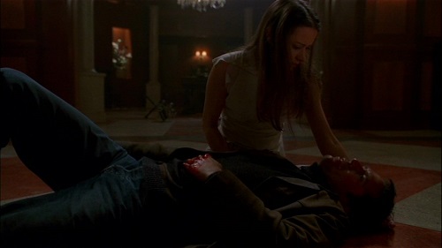 Illyria as Fred comforts Wesley in the Angel finale, "Not Fade Away"