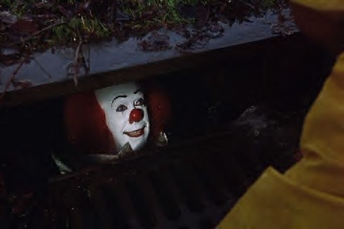Tim Curry as Pennywise the Clown in Stephen King's IT