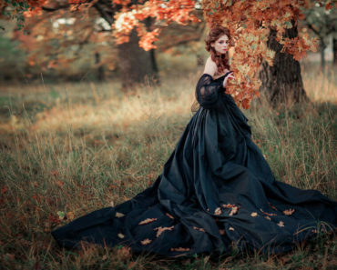 A woman wearing a Gothic gown.