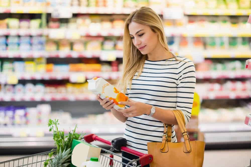 Woman shopping on a grocery store. 