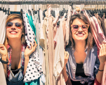 Two friends having fun on a vintage shop.