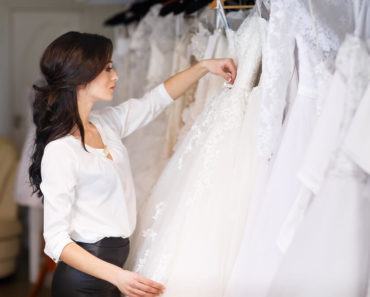 Woman choosing wedding dress.