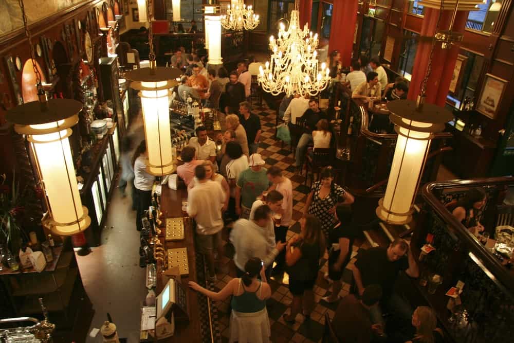 Overhead view of a bar packed with customers.