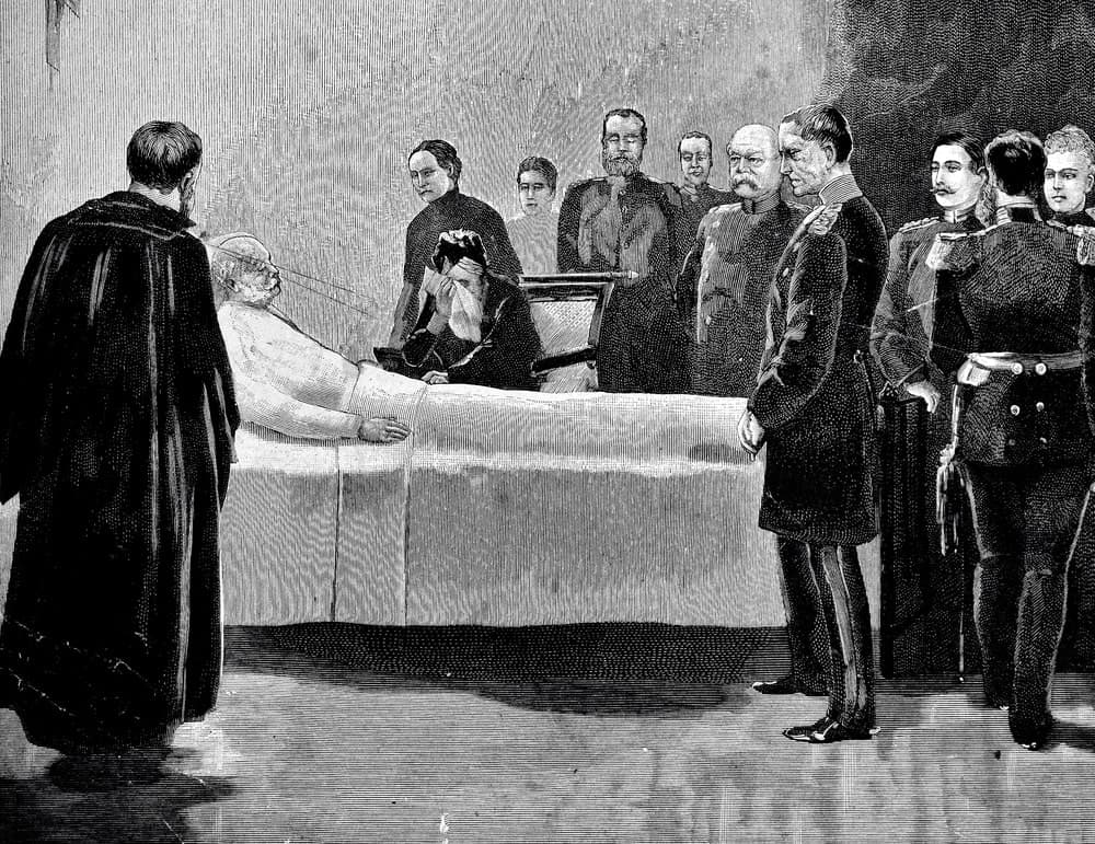 Black and white deathbed scene of an old man lying in bed and surrounded by men in different uniforms.