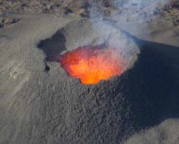 Magma as it nears the rim of the crater of a volcano.