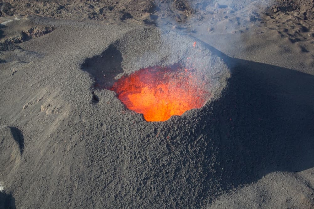 Magma as it nears the rim of the crater of a volcano.