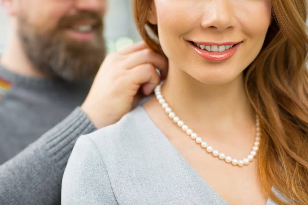 Lady wearing a pearl necklace