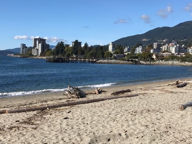 View of the pier at Ambleside Beach in West Vancouver, BC