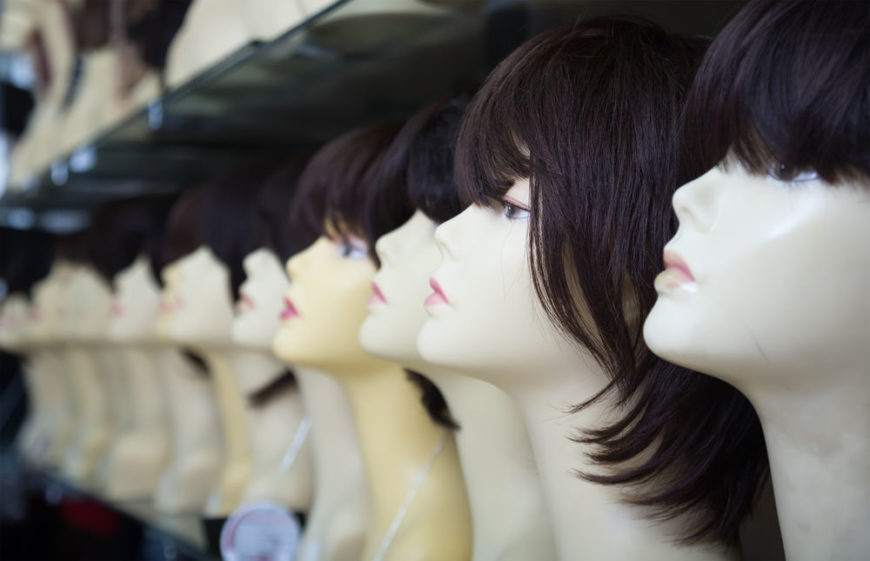 A row of wigs