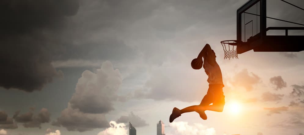 Basketball player playing on outdoor court