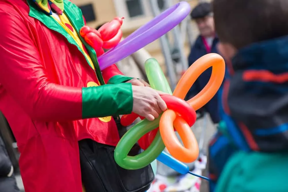 Clown creating balloon animals