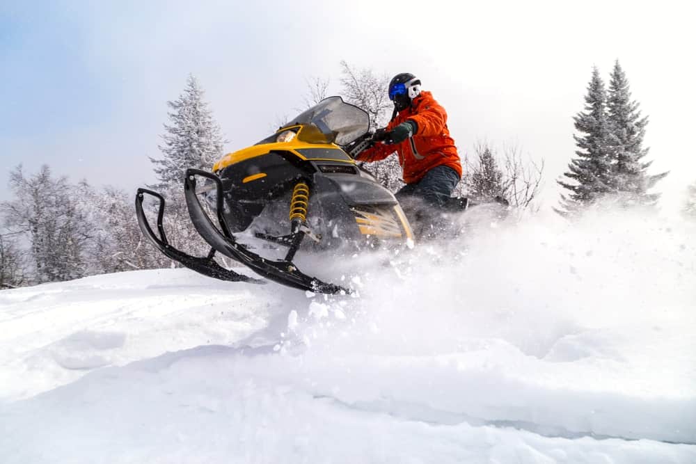 Man riding a snowmobile