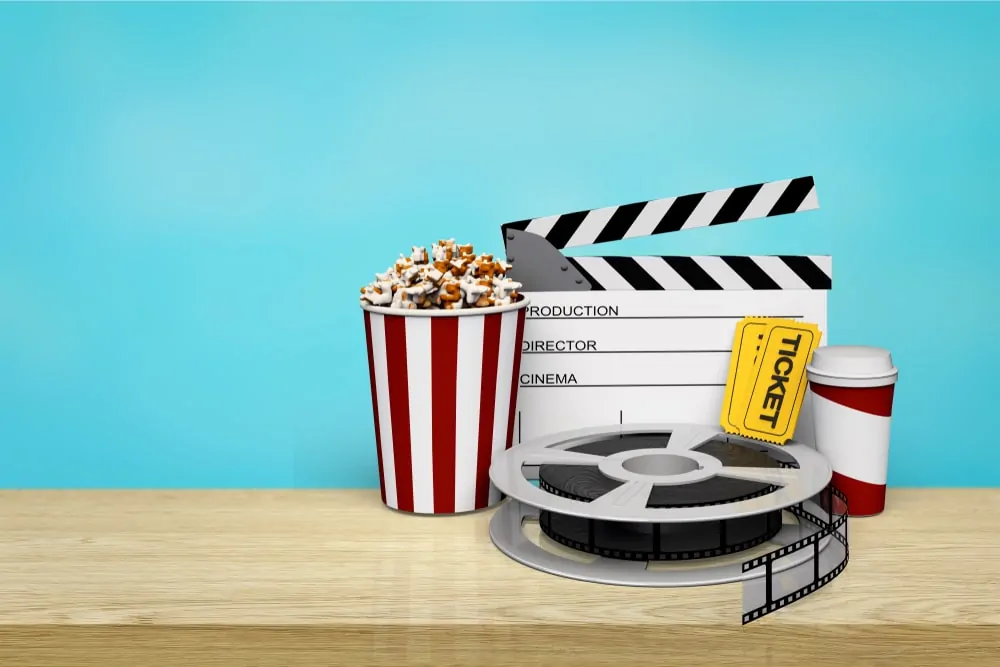 Clapper, movie, ticket, and snacks