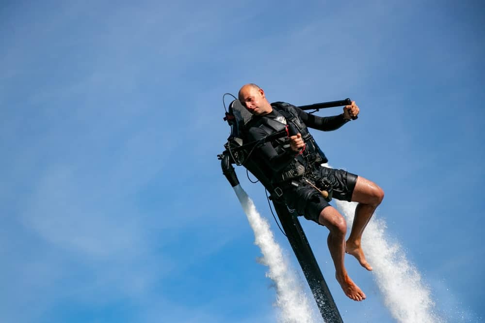 An athlete strapped to a jetpack