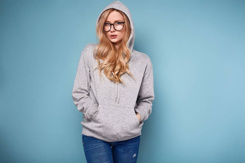 Girl wearing a grey hoodie