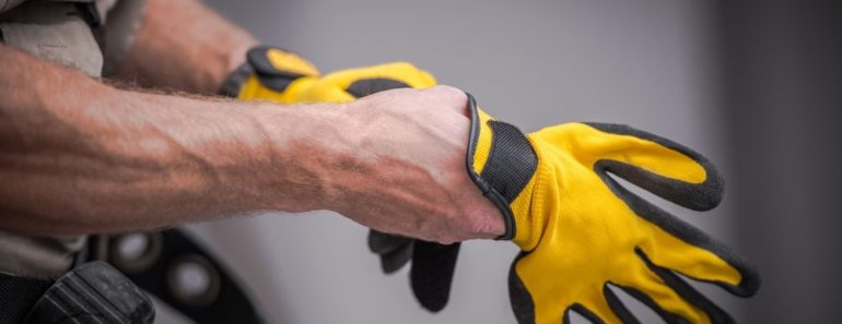 man trying on gloves