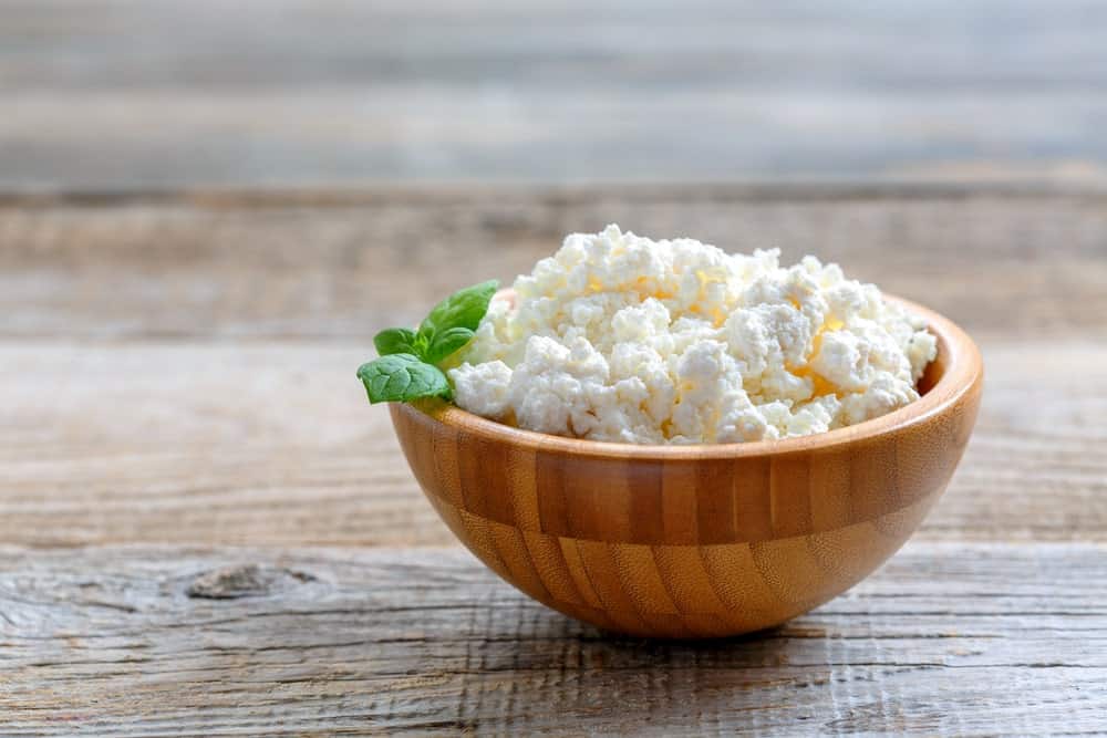 Homemade Cottage Cheese in a Wooden Bowl