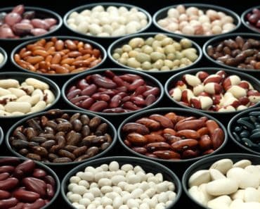 Bowls of various types of beans and legumes.