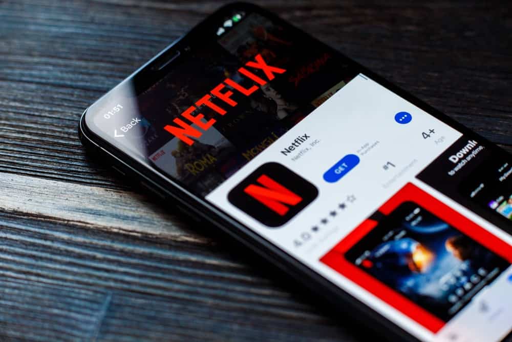 A mobile phone showing the download page for Netflix at the App Store.