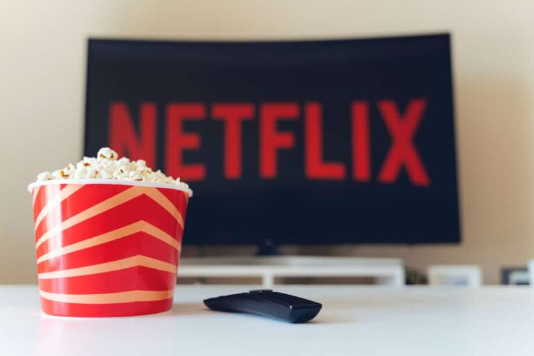 TV displaying Netflix logo with popcorn on the side.
