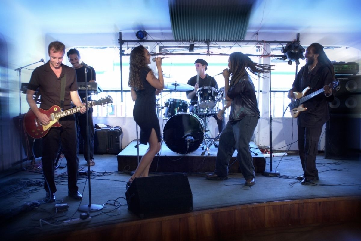 A band with two vocalist singing.