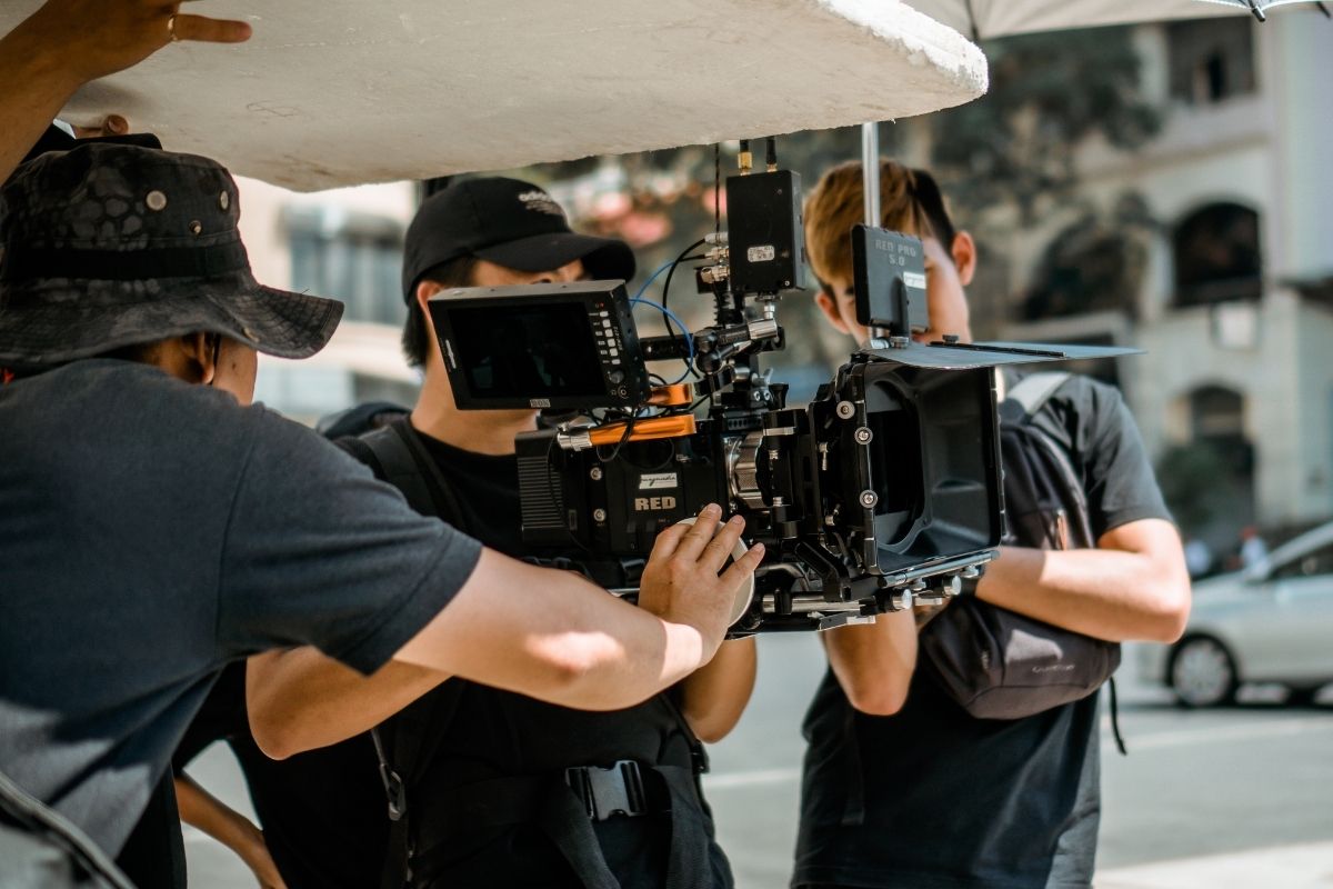 A photo of a man holding a camera.