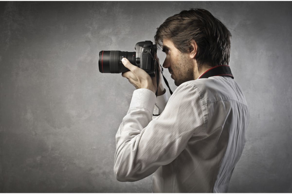 A man taking photos using camera.