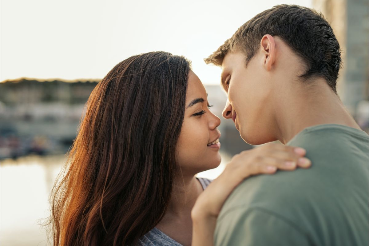 A couple so close at eachother photo.