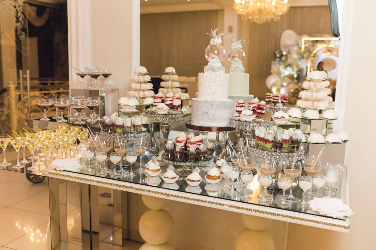 Dessert bar with pastries, ice cream, and drinks.