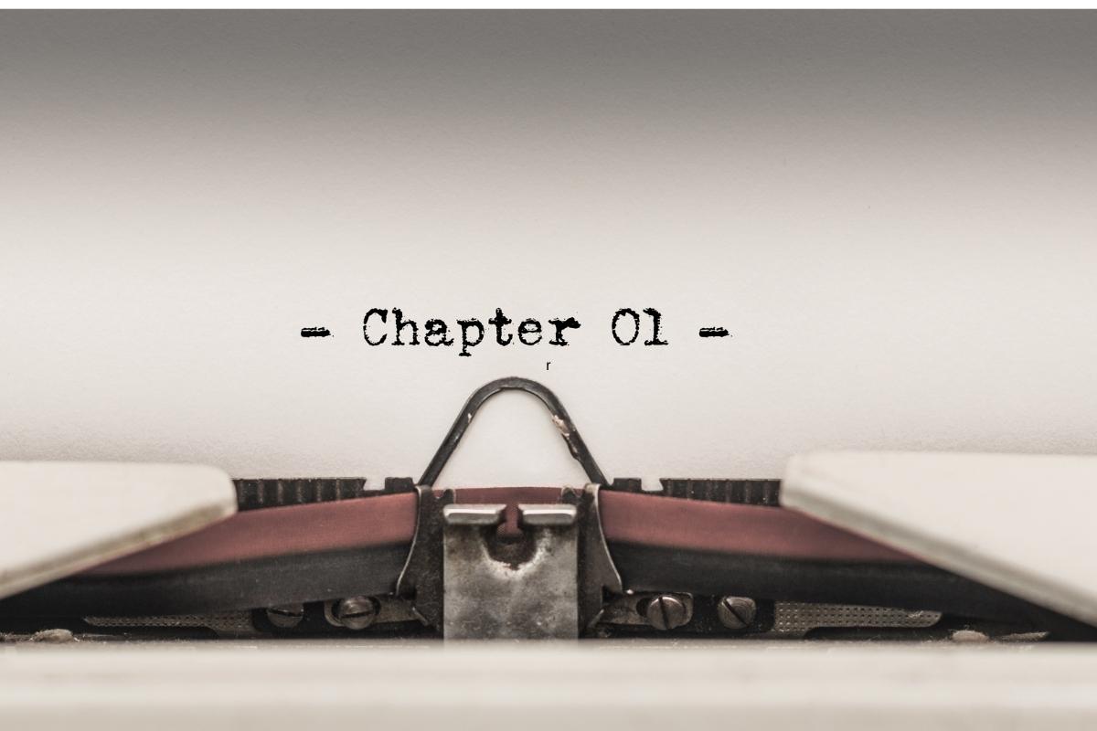 A photo of the word chapter 1 written in a typewriter.