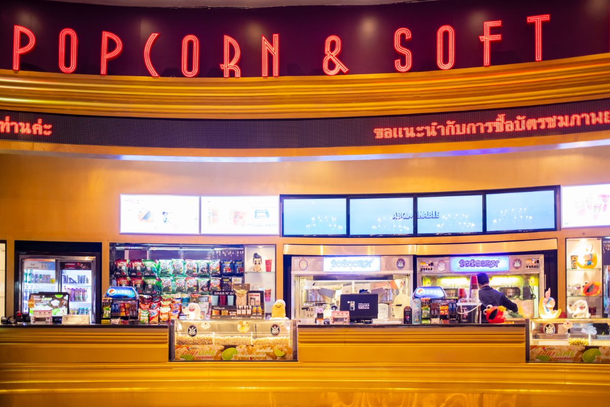 Front view of a popcorn and softdrink counter at the movie theatre entrance.
