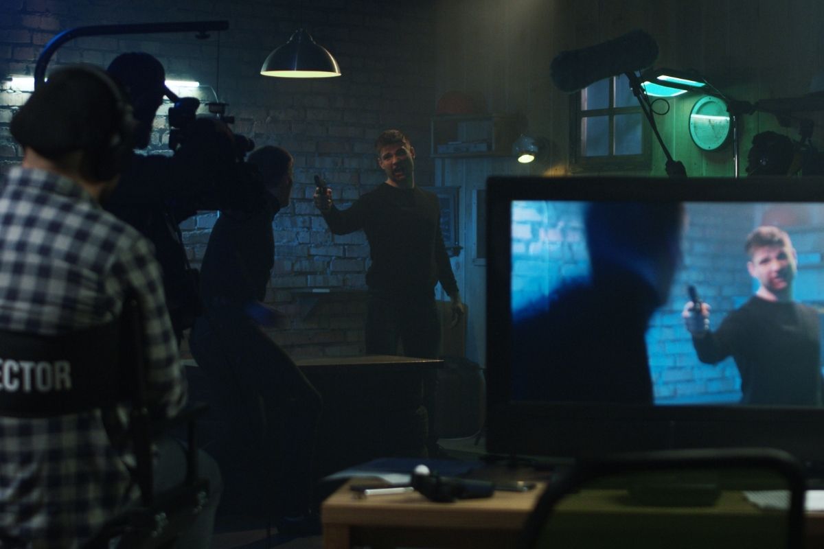 The director watching a fighting scene on set.
